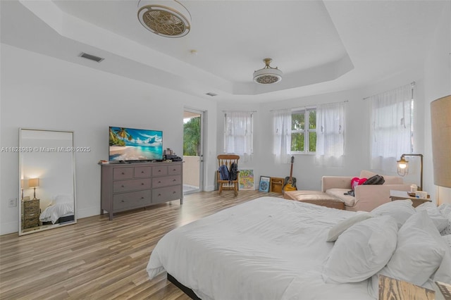 2620 SW 150th Ct, Miami, FL 33185 - bedroom featuring a raised ceiling and wood finished floors