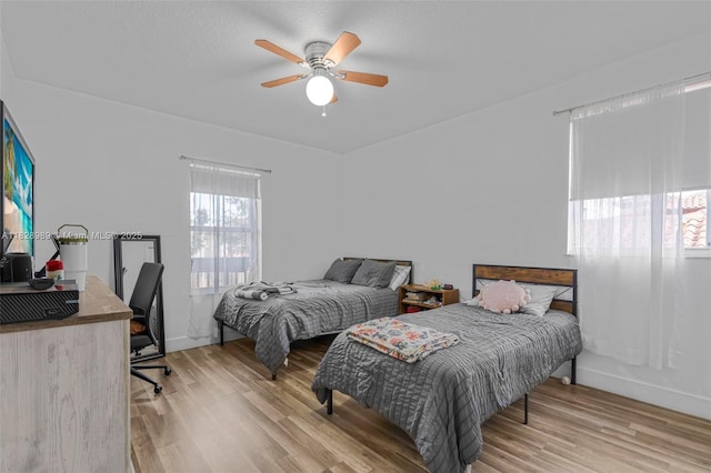 2620 SW 150th Ct, Miami, FL 33185 - bedroom with an office area, wood finished floors, and a ceiling fan