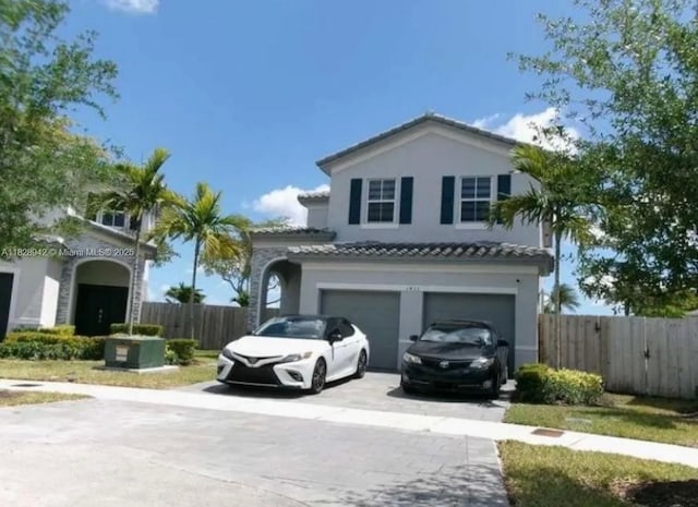 1433 SE 27th Ter, Homestead, FL 33035 - mediterranean / spanish home featuring concrete driveway, stucco siding, and a garage