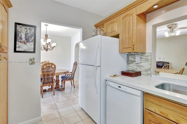 16702 NW 73rd Ct, Hialeah, FL 33015 - kitchen featuring white dishwasher, light countertops, light brown cabinets, light tile patterned flooring, and a ceiling fan
