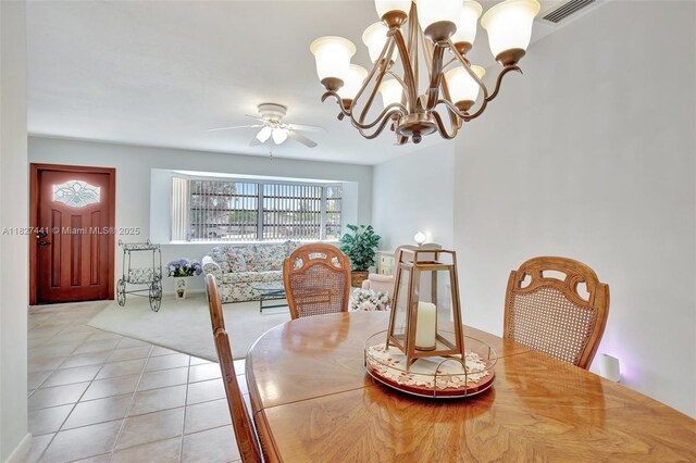 16702 NW 73rd Ct, Hialeah, FL 33015 - tiled dining room with a ceiling fan, carpet flooring, and a chandelier