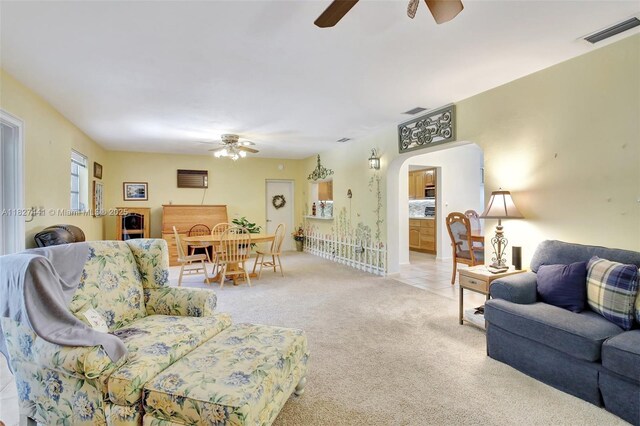 16702 NW 73rd Ct, Hialeah, FL 33015 - living room featuring ceiling fan, arched walkways, and light colored carpet