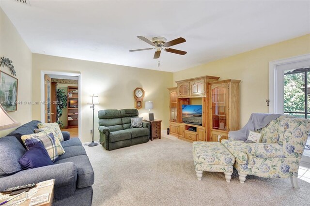 16702 NW 73rd Ct, Hialeah, FL 33015 - living room featuring light carpet and a ceiling fan