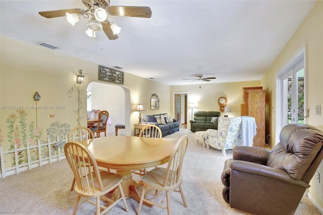 16702 NW 73rd Ct, Hialeah, FL 33015 - dining room featuring arched walkways, ceiling fan, and carpet floors