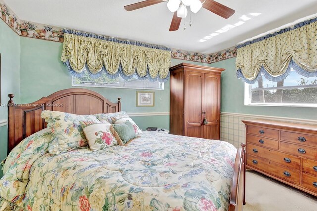 16702 NW 73rd Ct, Hialeah, FL 33015 - bedroom featuring wainscoting, ceiling fan, and carpet flooring