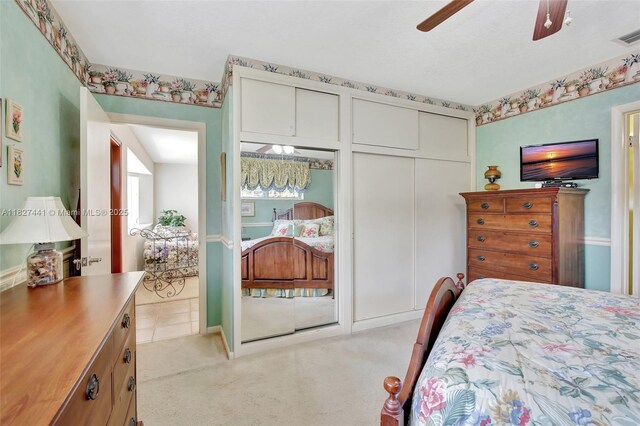 16702 NW 73rd Ct, Hialeah, FL 33015 - bedroom featuring light colored carpet, ceiling fan, and two closets