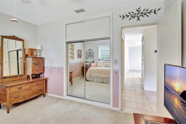 16702 NW 73rd Ct, Hialeah, FL 33015 - bedroom featuring a closet, light carpet, and light tile patterned floors