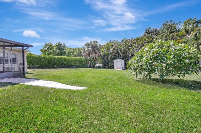16702 NW 73rd Ct, Hialeah, FL 33015 - view of green lawn with a storage shed
