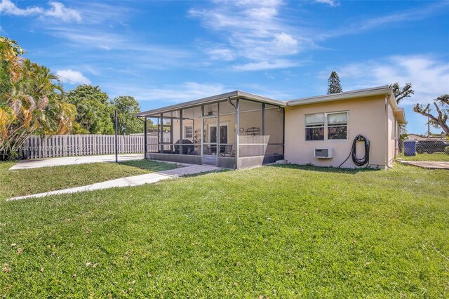 16702 NW 73rd Ct, Hialeah, FL 33015 - rear view of house featuring a sunroom and stucco siding