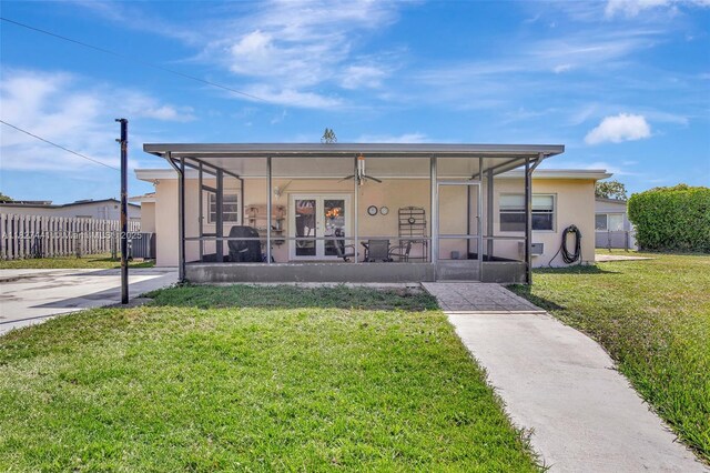 16702 NW 73rd Ct, Hialeah, FL 33015 - back of property featuring stucco siding and a sunroom
