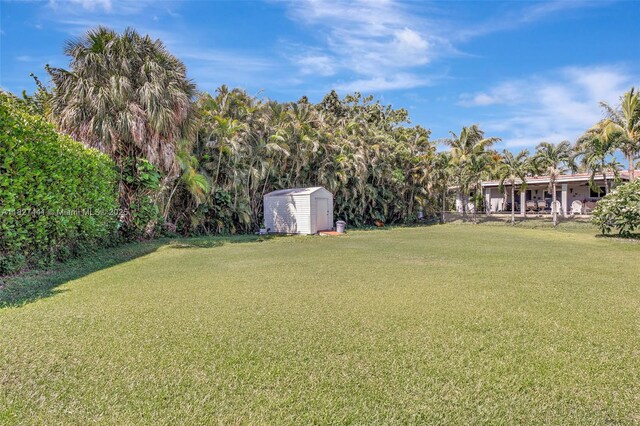 16702 NW 73rd Ct, Hialeah, FL 33015 - view of green lawn featuring a storage unit