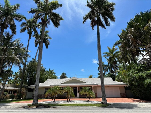 1330 Harrison St, Hollywood, FL 33019 - view of front of property with decorative driveway and a garage