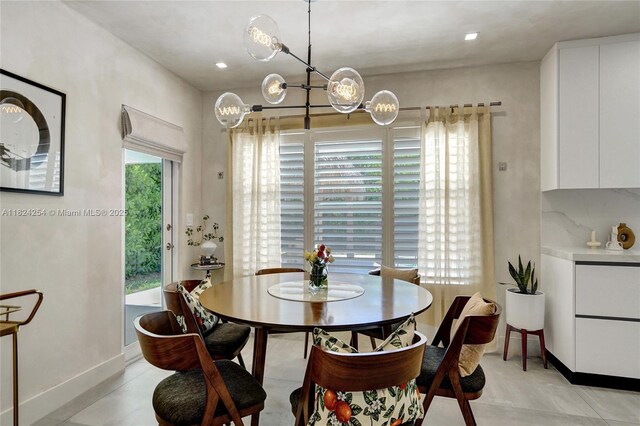 1330 Harrison St, Hollywood, FL 33019 - dining room with baseboards and a chandelier