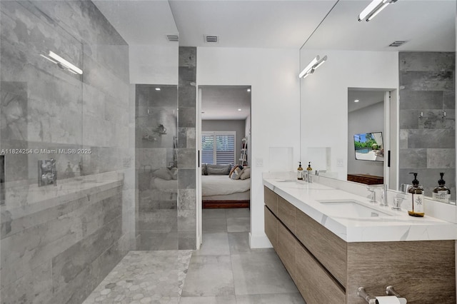 1330 Harrison St, Hollywood, FL 33019 - bathroom featuring double vanity, a walk in shower, ensuite bathroom, and tile patterned flooring