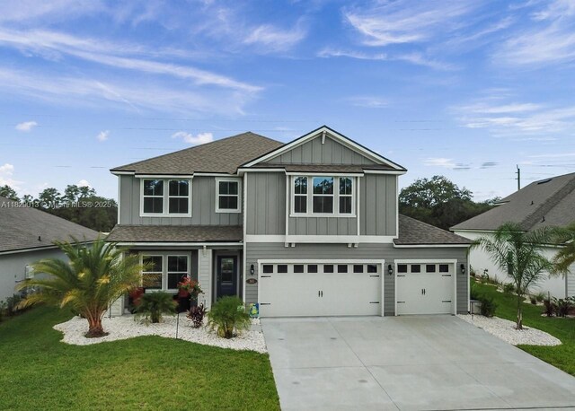 365 Cedarstone Way, Saint Augustine, FL 32092 - view of front of property with a shingled roof, board and batten siding, an attached garage, and concrete driveway