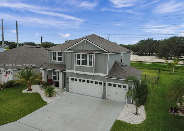 365 Cedarstone Way, Saint Augustine, FL 32092 - traditional-style home with a shingled roof, board and batten siding, concrete driveway, and a garage