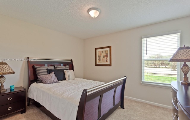 365 Cedarstone Way, Saint Augustine, FL 32092 - bedroom featuring light carpet, multiple windows, and a textured ceiling