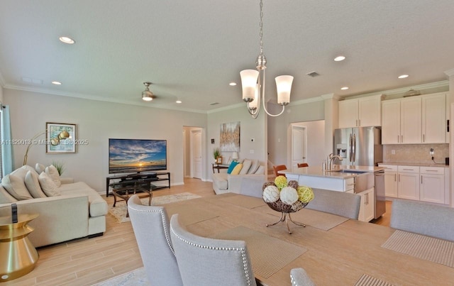 365 Cedarstone Way, Saint Augustine, FL 32092 - dining area with crown molding, recessed lighting, and light wood-style flooring
