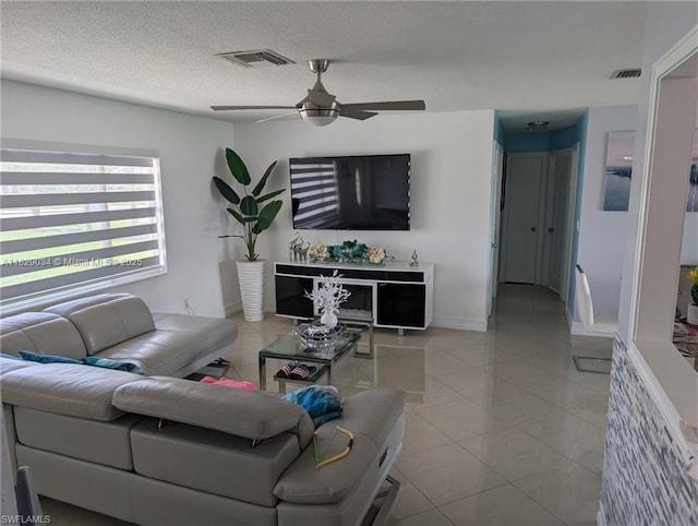 1206 Archdale St, Lehigh Acres, FL 33936 - living room featuring a ceiling fan, light tile patterned floors, and a textured ceiling