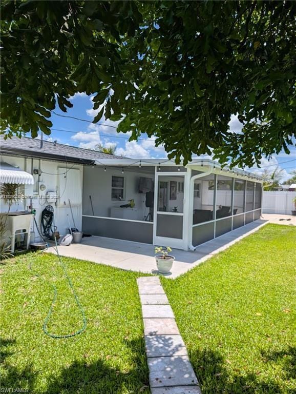 1206 Archdale St, Lehigh Acres, FL 33936 - rear view of house featuring a sunroom
