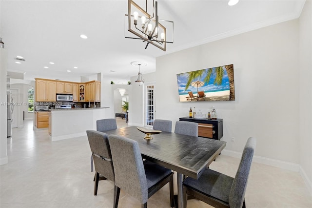 12851 Luray Rd, Southwest Ranches, FL 33330 - dining area featuring arched walkways, recessed lighting, a chandelier, and ornamental molding