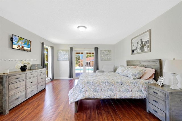 12851 Luray Rd, Southwest Ranches, FL 33330 - bedroom with dark wood-style flooring and access to exterior