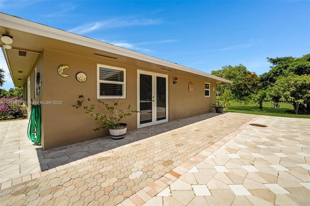 12851 Luray Rd, Southwest Ranches, FL 33330 - view of patio featuring french doors