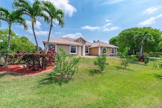12851 Luray Rd, Southwest Ranches, FL 33330 - view of front of property featuring a tiled roof, stucco siding, and a front lawn