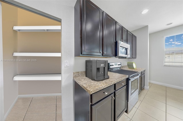 14776 SW 10th St Unit 10501, Pembroke Pines, FL 33027 - kitchen featuring appliances with stainless steel finishes, light tile patterned floors, and recessed lighting