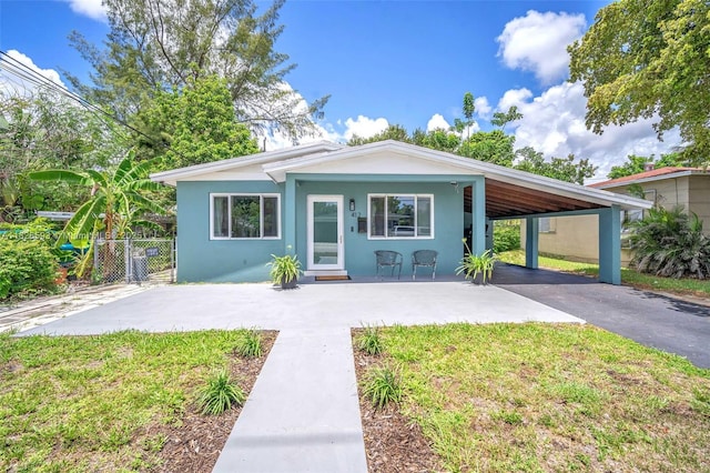 412 S 24th Ave, Hollywood, FL 33020 - view of front of house with stucco siding, asphalt driveway, and a carport