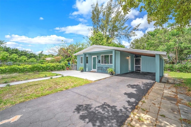 412 S 24th Ave, Hollywood, FL 33020 - view of front of home with driveway, a carport, and a front lawn