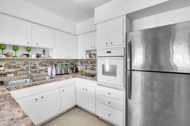 412 S 24th Ave, Hollywood, FL 33020 - kitchen featuring freestanding refrigerator, oven, open shelves, black electric stovetop, and tasteful backsplash