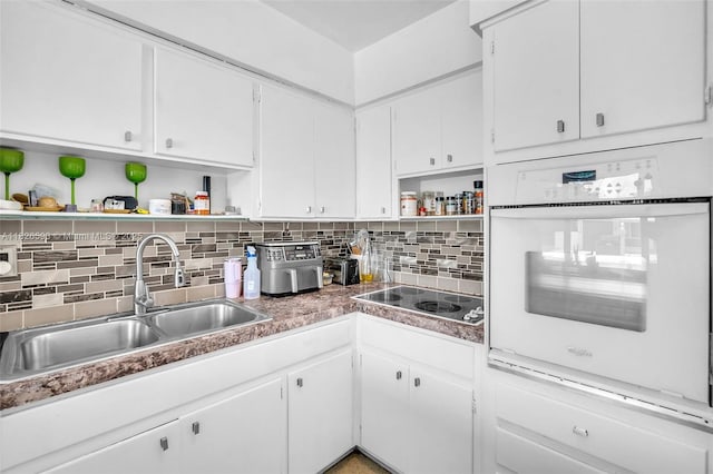 412 S 24th Ave, Hollywood, FL 33020 - kitchen featuring open shelves, oven, electric stovetop, backsplash, and white cabinets