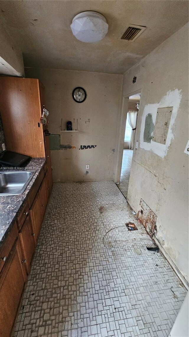 1710 SW 13th St, Miami, FL 33145 - bathroom featuring a sink and brick patterned flooring