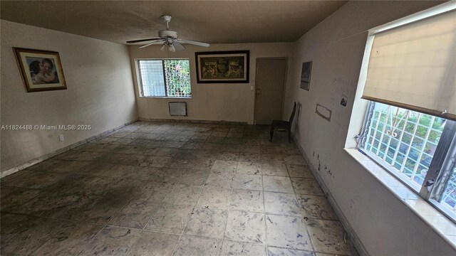 1710 SW 13th St, Miami, FL 33145 - empty room featuring a ceiling fan and baseboards