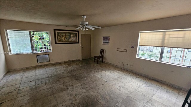 1710 SW 13th St, Miami, FL 33145 - empty room featuring healthy amount of natural light and ceiling fan