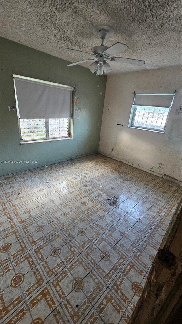1710 SW 13th St, Miami, FL 33145 - unfurnished room with a ceiling fan and a textured ceiling