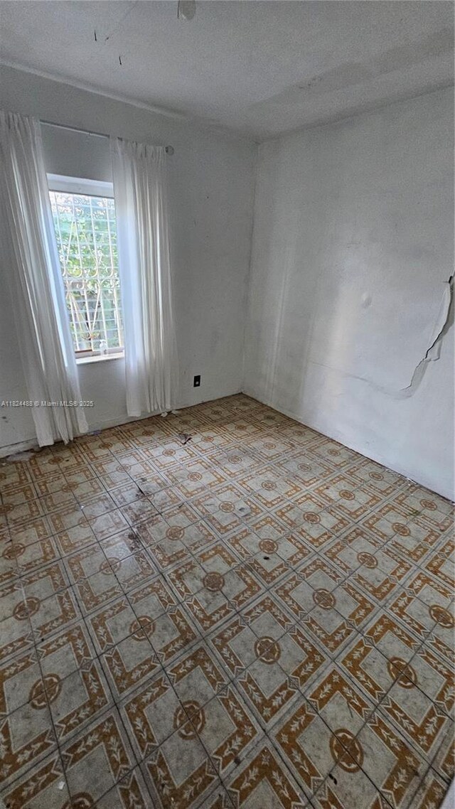 1710 SW 13th St, Miami, FL 33145 - spare room featuring a textured ceiling