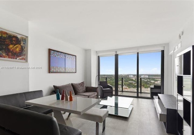 121 NE 34th St Unit 1812, Miami, FL 33137 - living area featuring a wall of windows