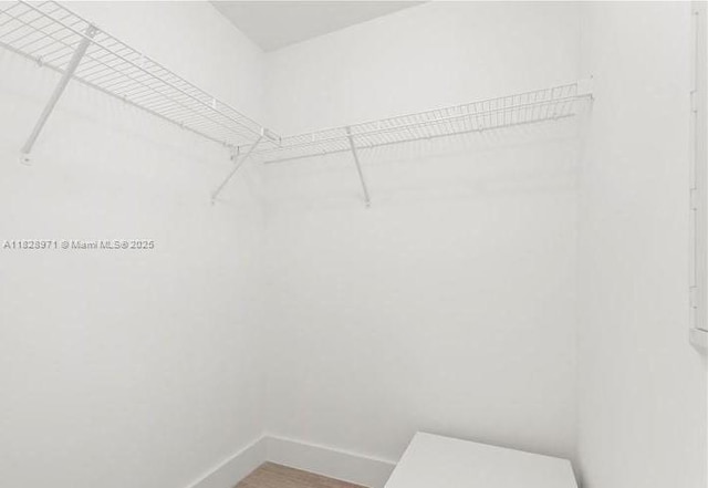 121 NE 34th St Unit 1812, Miami, FL 33137 - spacious closet featuring wood finished floors