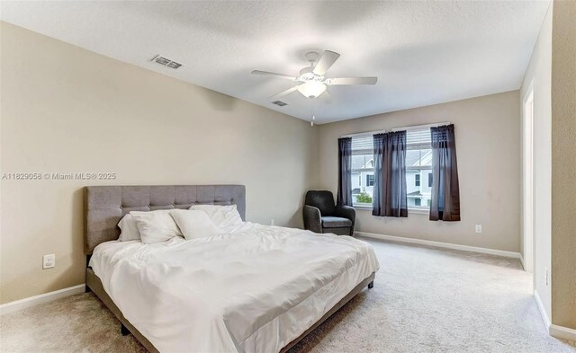 42 Appleton Ct, Saint Augustine, FL 32092 - bedroom featuring light colored carpet, a ceiling fan, and a textured ceiling