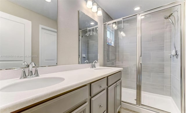 42 Appleton Ct, Saint Augustine, FL 32092 - bathroom with a shower stall, double vanity, and recessed lighting