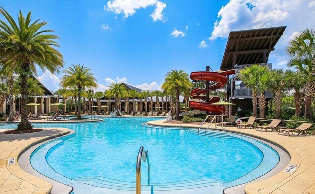 42 Appleton Ct, Saint Augustine, FL 32092 - community pool with a water slide and a patio area