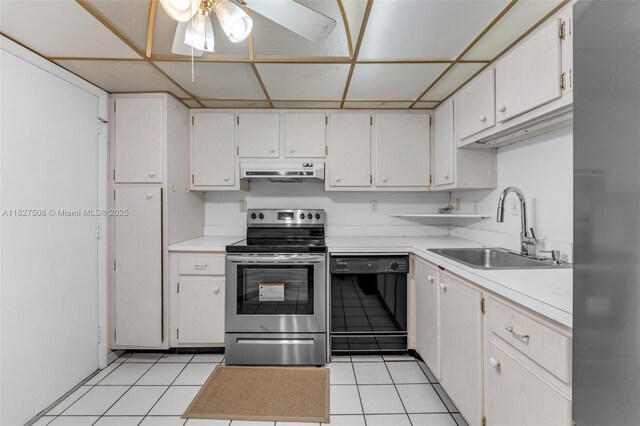9159 SW 77th Ave Unit 314, Miami, FL 33156 - kitchen featuring appliances with stainless steel finishes, under cabinet range hood, ceiling fan, light countertops, and light tile patterned floors