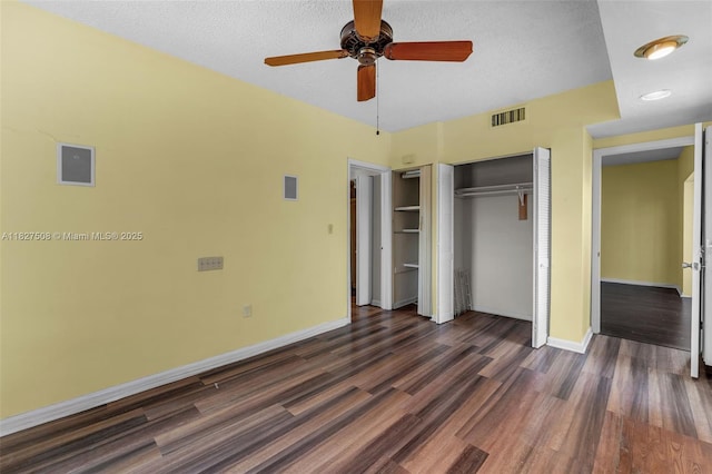 9159 SW 77th Ave Unit 314, Miami, FL 33156 - unfurnished bedroom with dark wood-style flooring, a closet, a textured ceiling, and a ceiling fan