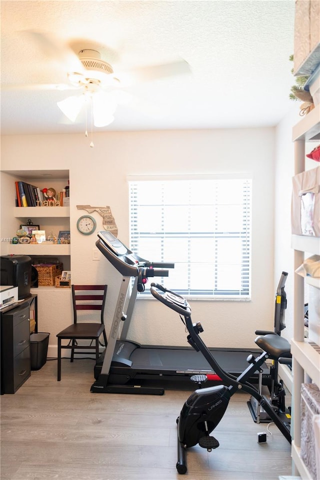 10631 NW 14th St Unit 212, Plantation, FL 33322 - exercise area featuring a ceiling fan and light wood finished floors