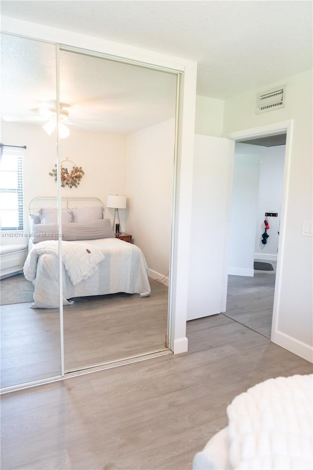 10631 NW 14th St Unit 212, Plantation, FL 33322 - bedroom featuring a closet and wood finished floors