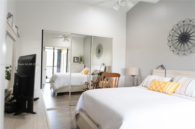 10631 NW 14th St Unit 212, Plantation, FL 33322 - bedroom featuring wood finished floors, a high ceiling, and a closet