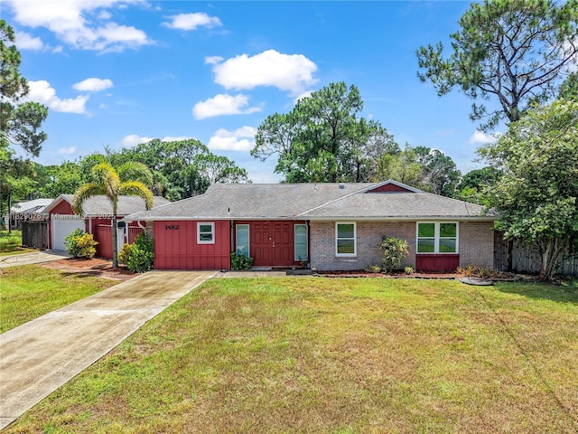 1482 SE Manth Ln, Port St Lucie, FL 34983 - single story home with concrete driveway, brick siding, and board and batten siding