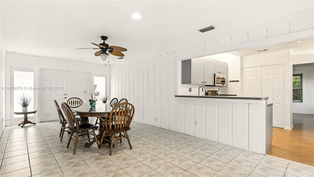1482 SE Manth Ln, Port St Lucie, FL 34983 - dining area with a ceiling fan, light tile patterned floors, and recessed lighting